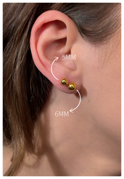 Model is wearing a 5mm and 6mm 24K ball studs