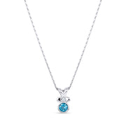 Silver necklace with a heart shaped blue topaz gemstone pendant on a white background.