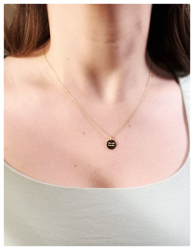 18K Yellow Coin Pendant with a necklace on a model's neck. 