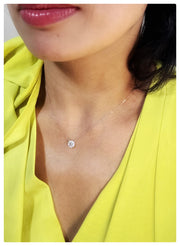 Model wearing an 18K diamond white gold halo baguette Pendant