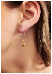 Model wearing the 18K yellow gold heather earrings