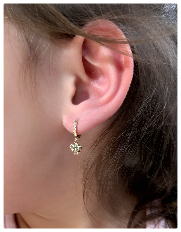 Model wearing the earrings on her ear