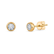 Pair of gold stud earrings with a bezel set diamond in the center. The earrings is on white background.