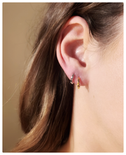 Model wearing both the 18K yellow and white lin earrings