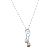 Silver necklace featuring two pearls separated by a small diamond pendant on a white background.