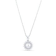 Silver pendant necklace featuring a round white pearl in the center. The pearl is surrounded by a halo of small round diamonds on a white background.