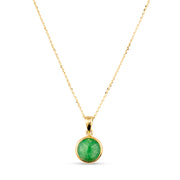 Gold chain necklace with a round jade pendant on a white background.