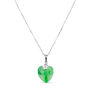 Silver chain necklace with a green jade heart pendant and a small flower detail.